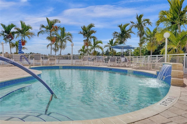 view of pool with pool water feature