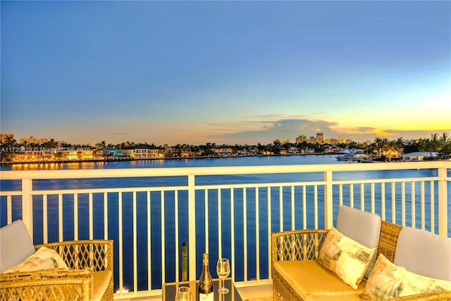 balcony at dusk with a water view