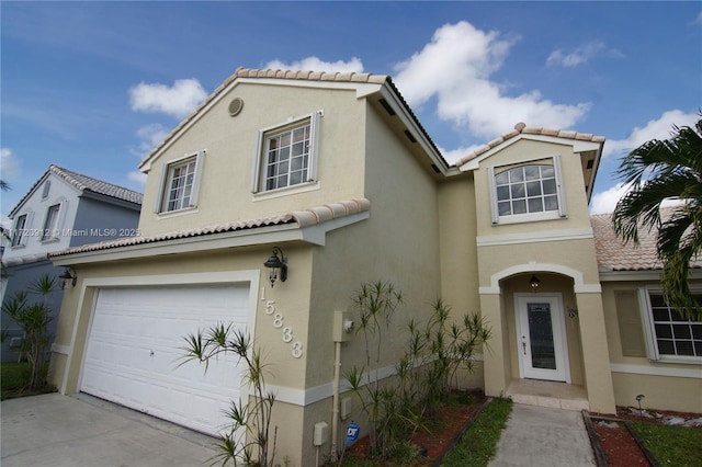 mediterranean / spanish-style home featuring a garage