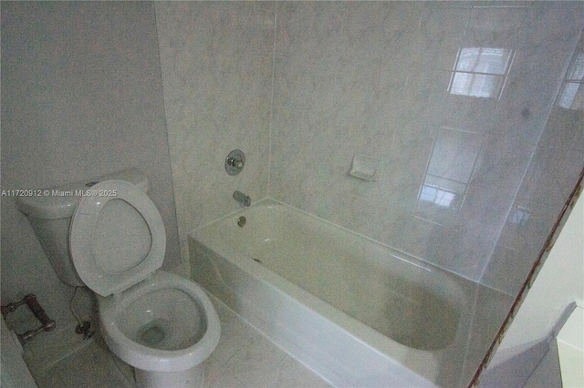 bathroom with tile patterned flooring and toilet