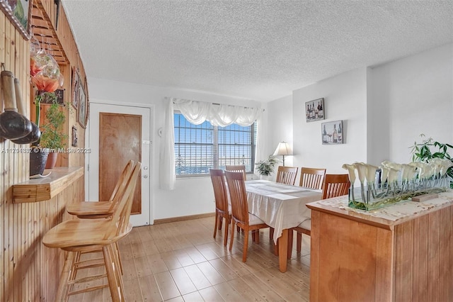 dining room featuring a textured ceiling