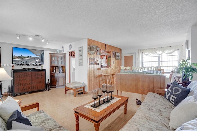 living room featuring a textured ceiling