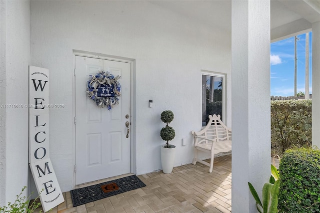 doorway to property with stucco siding