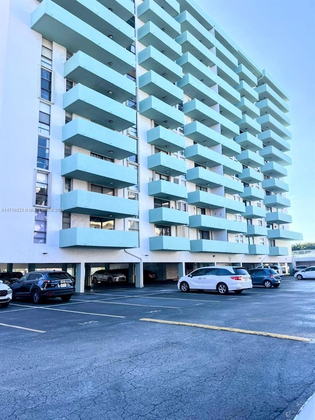 view of property featuring uncovered parking
