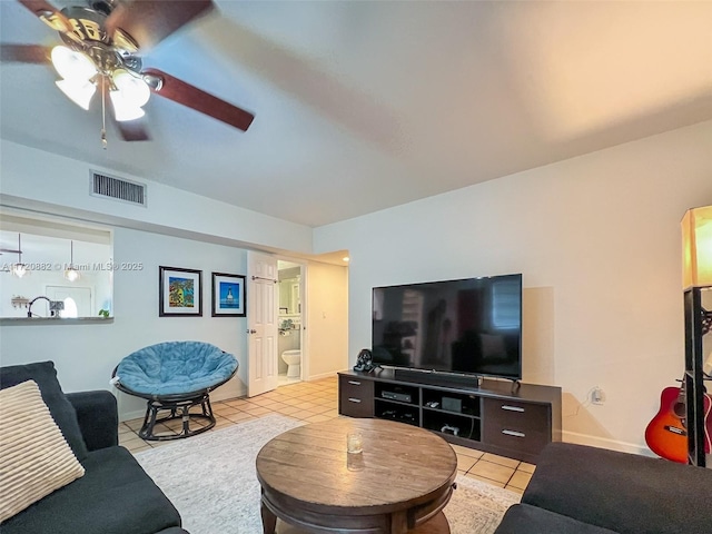 tiled living room featuring ceiling fan