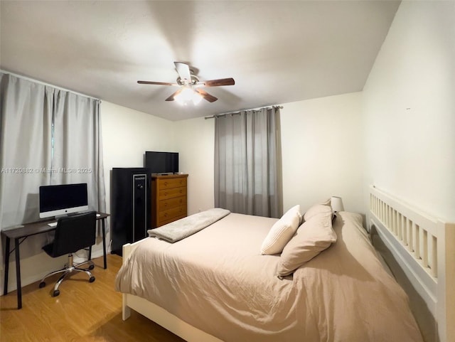 bedroom with hardwood / wood-style flooring and ceiling fan