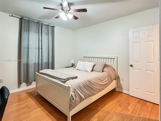 bedroom with ceiling fan and light hardwood / wood-style floors