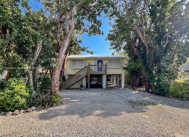 beach home featuring a carport