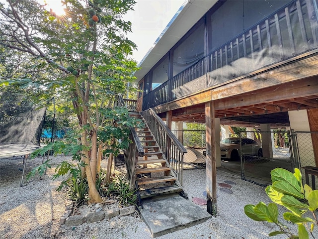 view of patio / terrace featuring a wooden deck and a trampoline