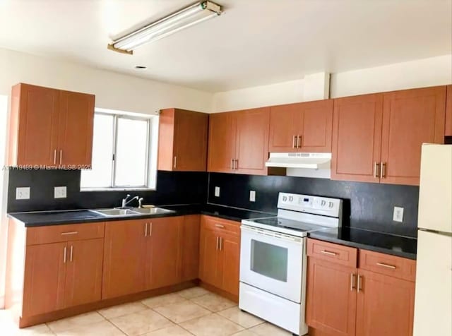 kitchen featuring tasteful backsplash, white appliances, sink, and light tile patterned floors