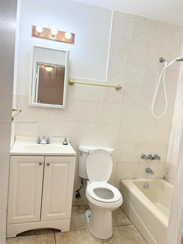 full bathroom with vanity, toilet, tiled shower / bath combo, and tile patterned flooring