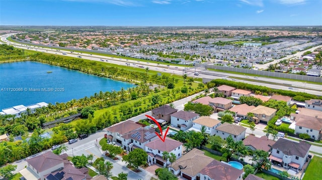 drone / aerial view with a water view