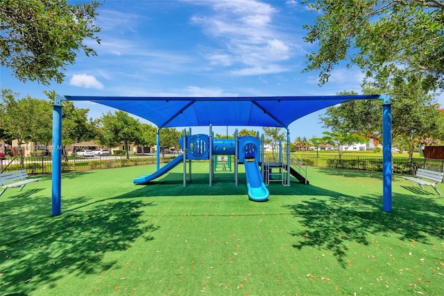 view of jungle gym with a lawn