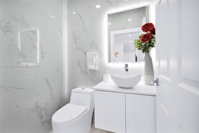 bathroom with vanity and toilet