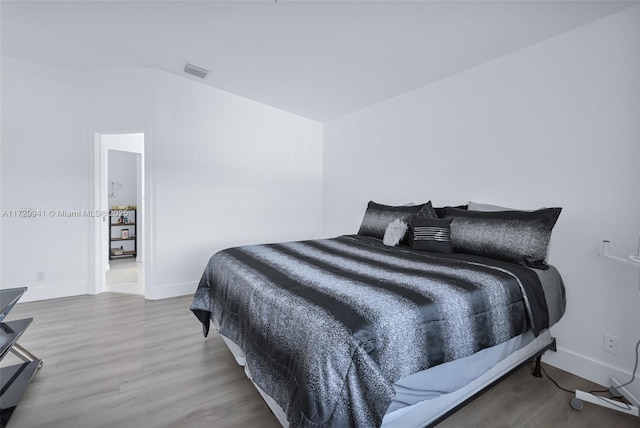 bedroom featuring hardwood / wood-style flooring