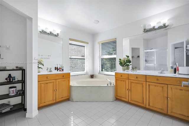 bathroom featuring tile patterned floors, vanity, and separate shower and tub