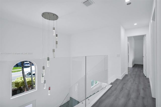 corridor featuring dark hardwood / wood-style flooring