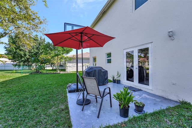 view of patio with area for grilling and french doors