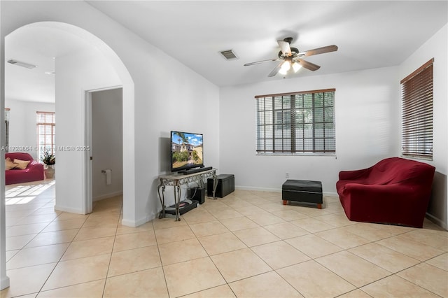 sitting room with ceiling fan and light tile patterned floors