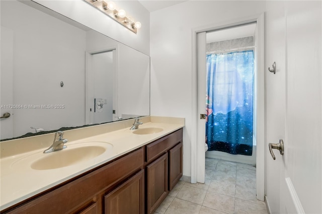 bathroom with tile patterned floors and vanity