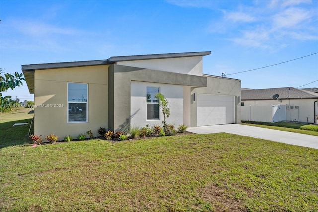 view of front of house featuring a front lawn and a garage