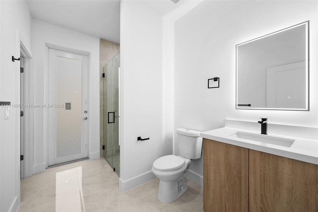 bathroom with vanity, a shower with shower door, and toilet