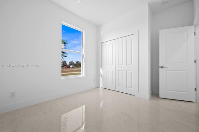 unfurnished bedroom featuring a closet