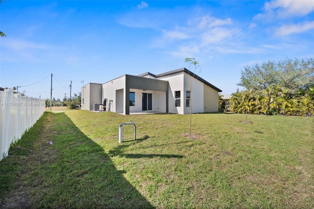 rear view of house with a lawn