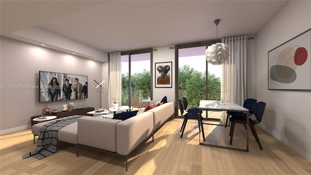 living room with a chandelier, light hardwood / wood-style flooring, and expansive windows