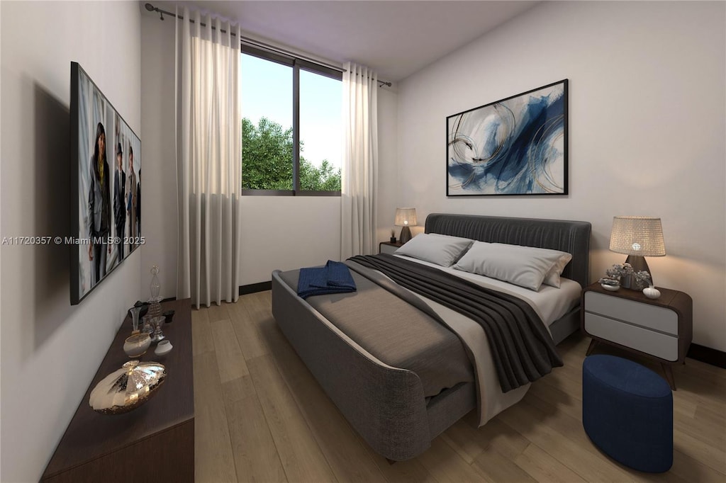 bedroom featuring light wood finished floors