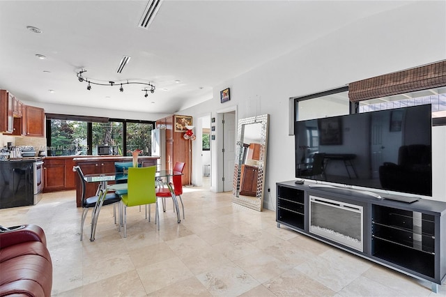 dining area featuring visible vents and track lighting