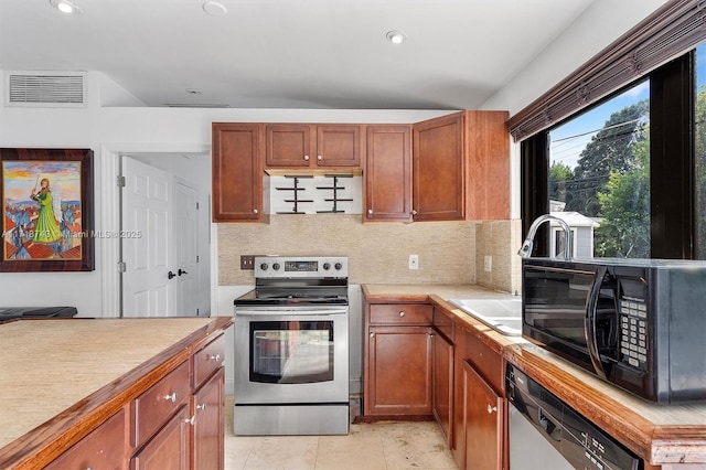 kitchen with backsplash and appliances with stainless steel finishes