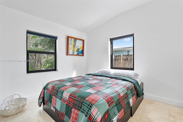 100 NE 51st St, Oakland Park, FL 33334 - bedroom featuring vaulted ceiling and baseboards