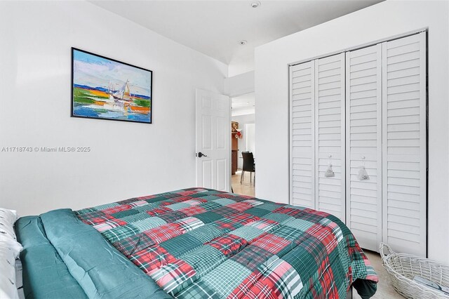 carpeted bedroom featuring a closet