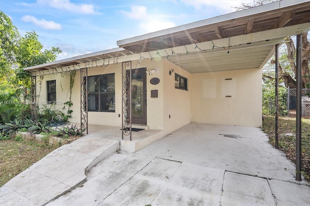 exterior space featuring a carport