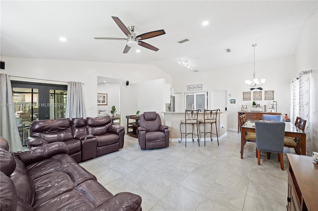 living room featuring french doors, ceiling fan with notable chandelier, and lofted ceiling