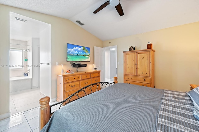 tiled bedroom featuring ensuite bath, ceiling fan, and lofted ceiling