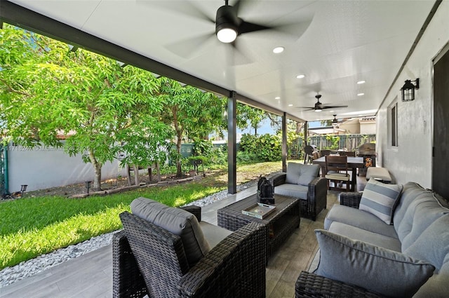 view of patio with ceiling fan and an outdoor hangout area