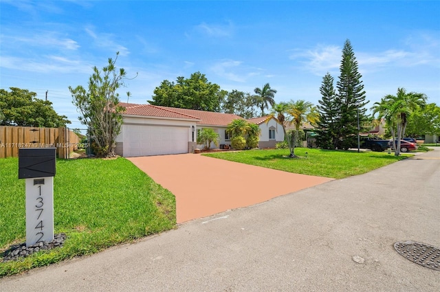 ranch-style house with a front yard and a garage