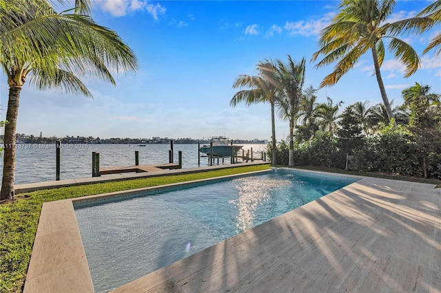 view of pool with a boat dock and a water view