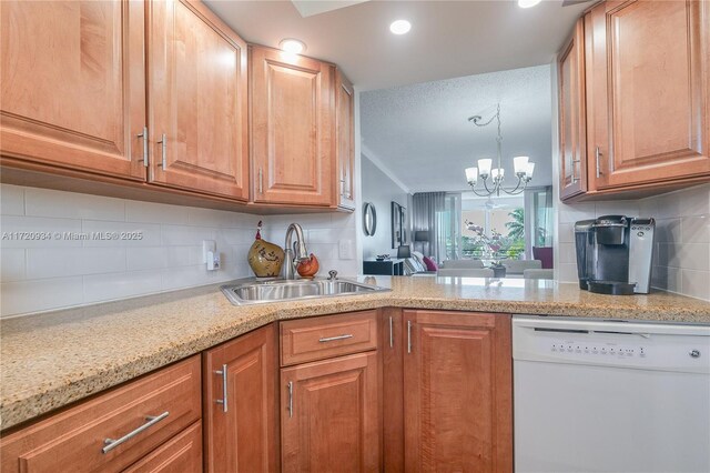 kitchen with dishwasher, decorative backsplash, a chandelier, and sink