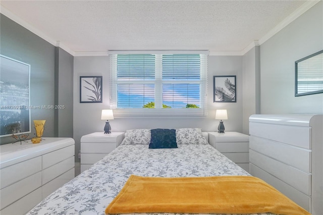 bedroom with a textured ceiling and ornamental molding