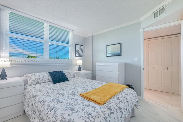 bedroom featuring a textured ceiling and ornamental molding