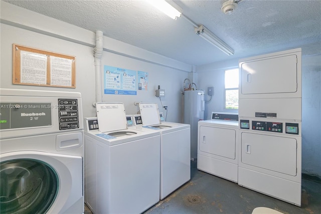 laundry area with electric water heater, stacked washer / drying machine, independent washer and dryer, and a textured ceiling