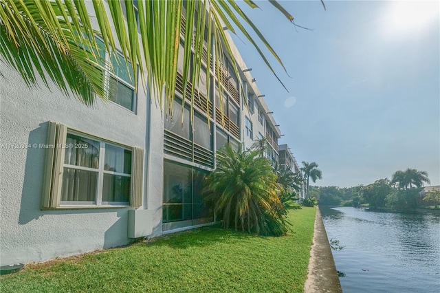 exterior space with a water view