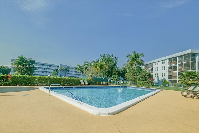 view of pool featuring a patio area