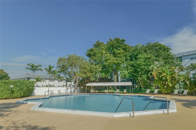 view of swimming pool featuring a patio