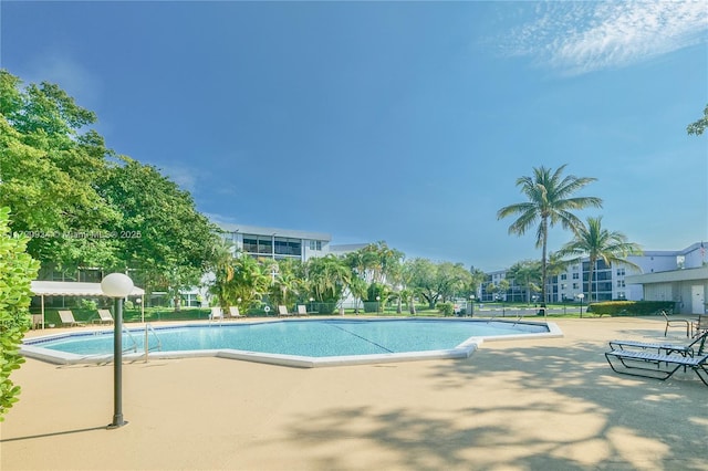 view of swimming pool featuring a patio area