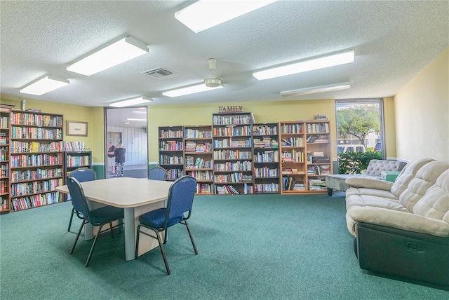 office with carpet flooring and a textured ceiling