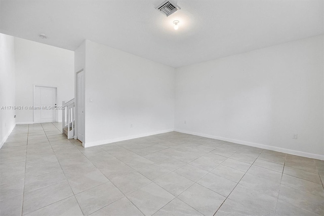 empty room with light tile patterned flooring